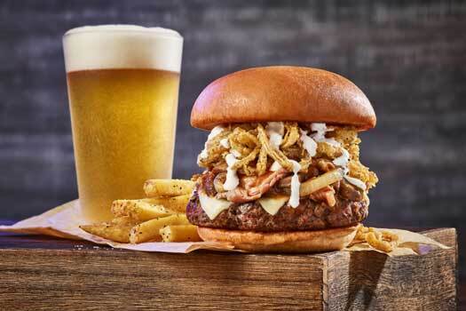 a prime burger with fries and a beer