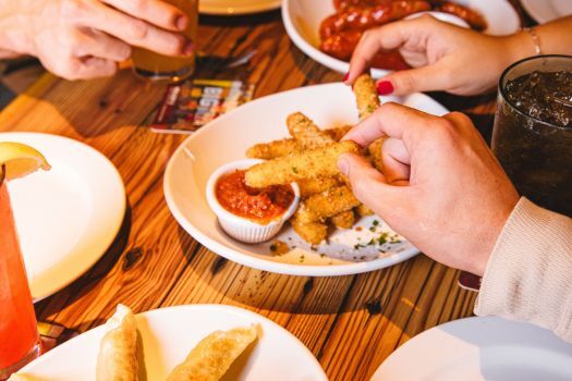 friends sharing mozzarella sticks
