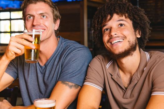 two friends hanging out and watching sports